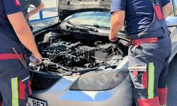 Ayvalık'ta seyir halinde alevler içinde kalan otomobilin imdadına beton mikseri yetişti