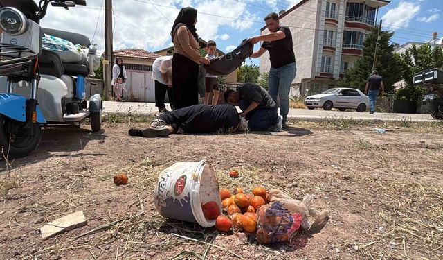 Yerde yatan yaralı kadına mont ile gölgelik yaptılar