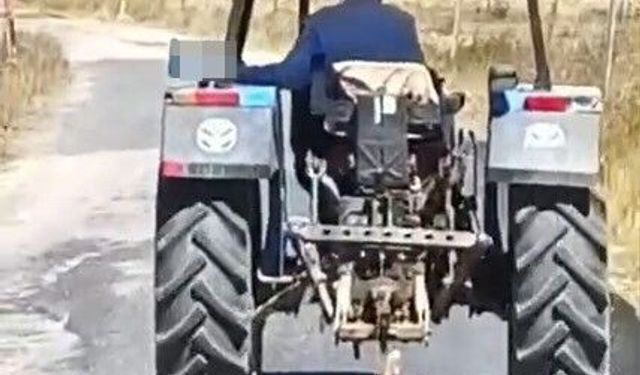 Köpeği traktöre bağlayarak sürükledi